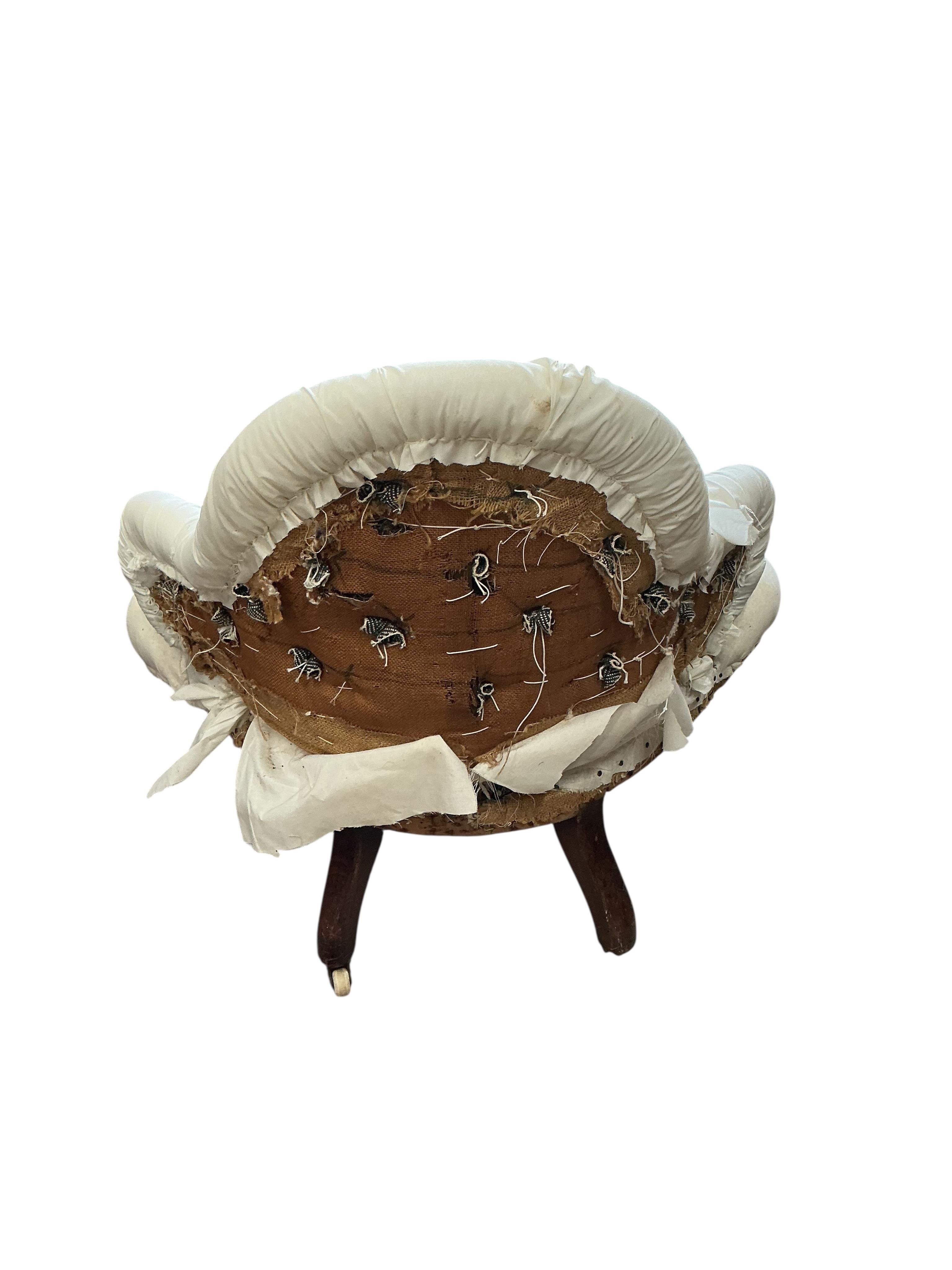 A Victorian part upholstered salon chair, width 86cm, height 78cm, in need of restoration